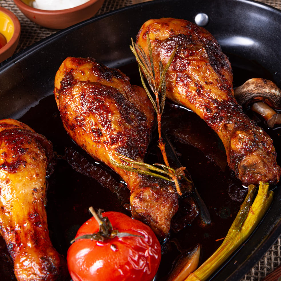 grilled chicken legs in barbecue marinade with sweet potatoes